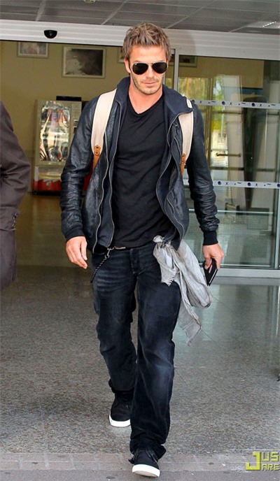 David Beckham is decked out in a Burberry backpack and scarf as he arrives at an airport in Nice, France on Tuesday (June 29, 2010).