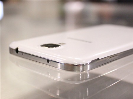 It has a built-in infrared blaster that can be used as a universal remote to control your TV. (The IR blaster is that little black dot at the top of the phone.) The phone also has a special app that pulls in data from your cable or satellite provider and can suggest shows you may like to watch.