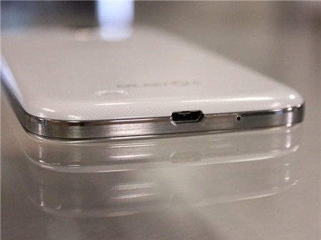 It uses a standard micro USB plug to charge and sync with your computer. These plugs are much easier to find than Apple's special Lightning port on the iPhone 5S.