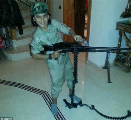 Sickening: ISIS sympathisers took to social media to identify the 10-year-old cub fighter by his alleged nom de guerre Abu Ubaidah. He is said to have died fighting alongside his father in Syria in recent weeks