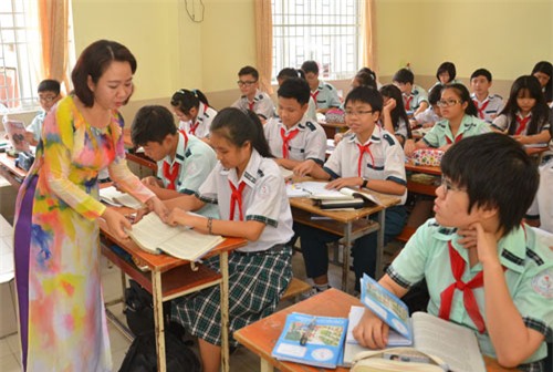 Đề thi văn cần giúp học sinh yêu môn văn hơn. Trong ảnh: Học sinh lớp 9 tại một trường THCS ở TP HCM trong giờ học văn Ảnh: TẤN THẠNH