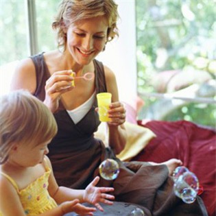 toddler playing with bubbles