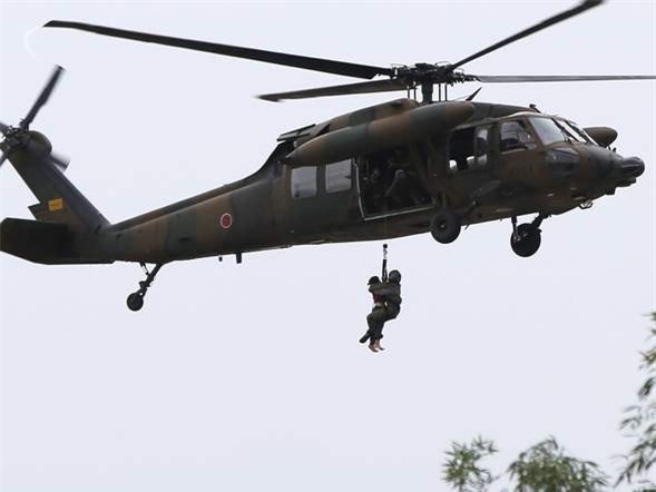 Đường phố thành sông sau khi bão đổ bộ Nhật Bản