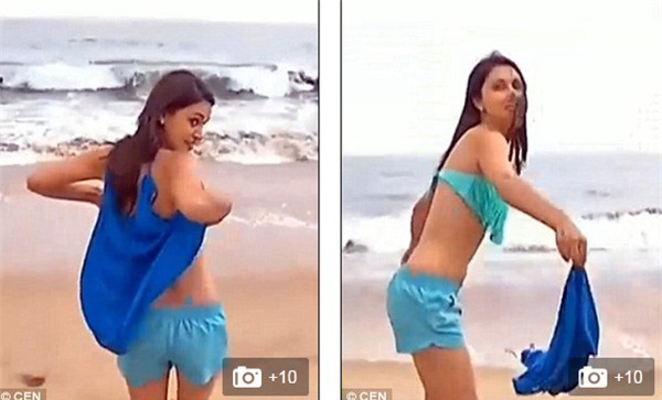 Nữ phóng viên xinh đẹp bị sóng đánh tụt bikini trên sóng truyền hình - Ảnh 2.