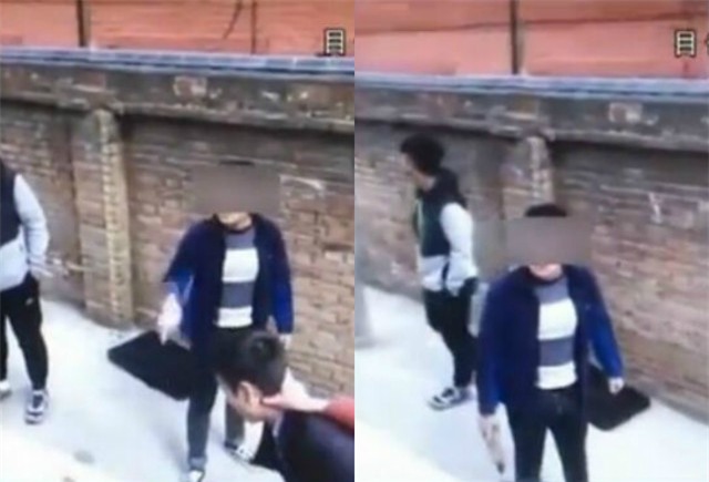 Trong khi một học sinh tóm cổ và dí thầy vào tường thì học sinh còn lại đang lớn tiếng cảnh cáo người quay phim.