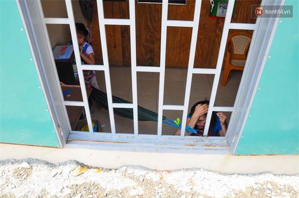 Nâng đường chống ngập ở Sài Gòn, hàng loạt ngôi nhà biến thành... hầm - Ảnh 16.