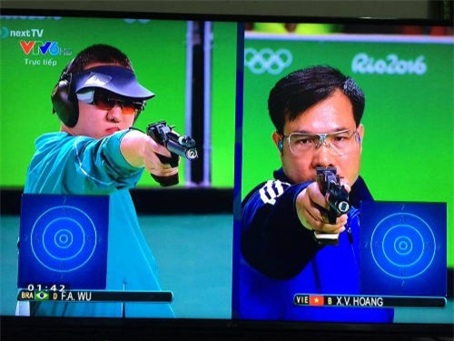 'Người đàn bà thép' sau tấm HCV Olympic: 'Vinh nói tấm huy chương này em dành tặng chị' - 2