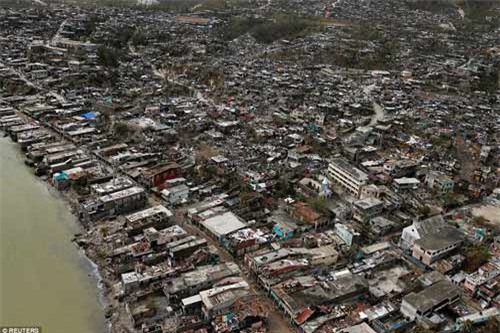 Cảnh hoang tàn và chết chóc ở Haiti sau cơn bão lịch sử Matthew - 4