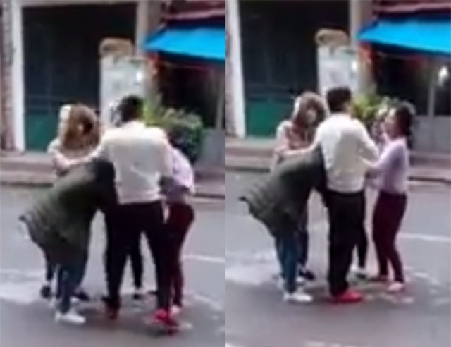 Chồng thẳng tay tát vợ vì dám chửi bới, túm tóc nhân tình của mình giữa đường - Ảnh 1.