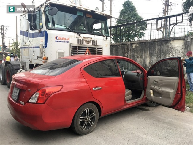 Xế hộp Nissan bị xe container đẩy lùi hàng chục mét, anh trai đạp cửa cứu 2 em - Ảnh 3.
