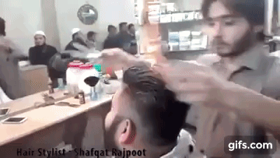 Kỳ lạ cửa tiệm cắt tóc bằng lửa vẫn nườm nượp khách - Ảnh 3.