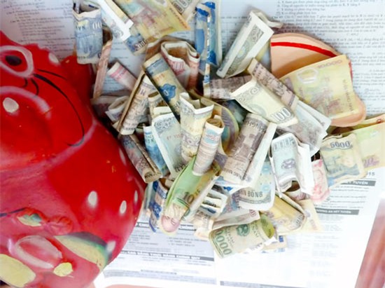 Mỗi ngày bỏ ống heo 50.000 đồng thôi, số tiền bạn tiết kiệm được dư đóng 1 năm học phí cho con - Ảnh 1.