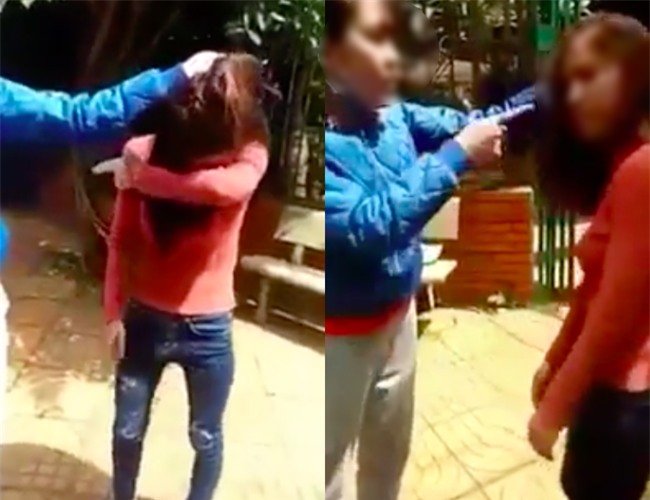 Người vợ túm tóc, tát liên tiếp vào mặt cô gái trẻ vì cố tình cặp kè với chồng mình - Ảnh 1.