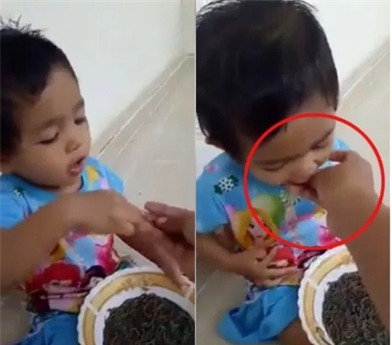 Clip sốc: Mẹ kế cho con gái 1 tuổi ăn sáng bằng giun đất sống gây tranh cãi - Ảnh 2.
