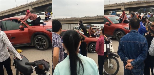 Hà Nội: 2 phụ nữ trèo lên ô tô, dùng gậy đập cửa kính đánh ghen ngay trên phố - Ảnh 2.