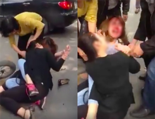 Sau va chạm giao thông, hai cô gái lao vào túm tóc, giằng co giữa phố Hà Nội - Ảnh 1.