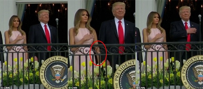 Video: Đệ nhất phu nhân Mỹ Melania nhắc chồng đặt tay lên ngực khi chào cờ - Ảnh 2.