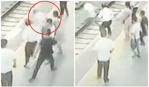 Clip: Bị sàm sỡ, người phụ nữ đẩy đối phương ngã sấp mặt xuống đường ray tàu hỏa - Ảnh 2.