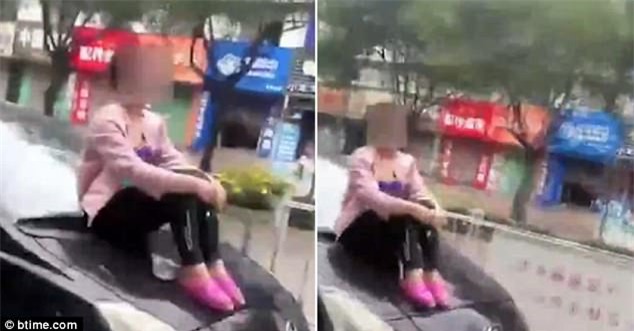 Cãi nhau với chồng, vợ bất chấp tính mạng bám trụ trên nóc capo xe đang chạy - Ảnh 2.