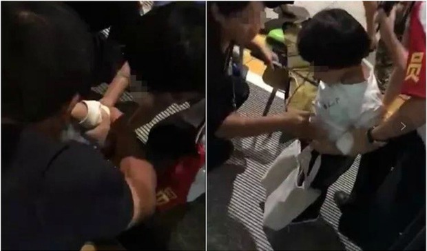 Mẹ mải xem điện thoại, con lọt chân xuống rãnh đường ray tàu mà không hay biết - Ảnh 1.