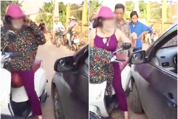 Người phụ nữ cởi áo, chửi lái xe ô tô như tát nước rồi xông vào đánh nhau vì bị nhắc nhở khi đứng giữa đường nghe điện thoại - Ảnh 2.