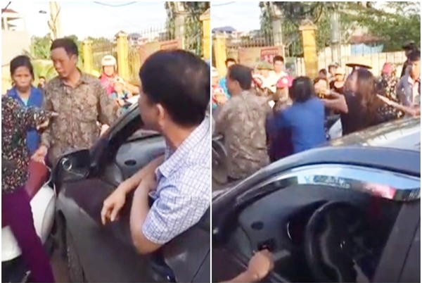 Người phụ nữ cởi áo, chửi lái xe ô tô như tát nước rồi xông vào đánh nhau vì bị nhắc nhở khi đứng giữa đường nghe điện thoại - Ảnh 3.