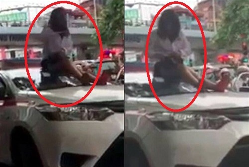Bị CSGT dừng xe vì vượt đèn đỏ, nữ tài xế taxi trèo lên nóc xe ăn vạ