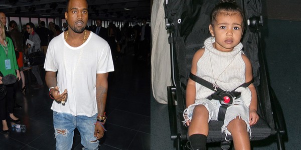 Yên vị trên xe đẩy thì bé cũng phải diện jeans rách cho thật "oách" giống bố Kanye.