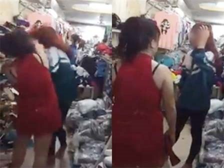 Cô gái mặc áo đồng phục bị bắt quả tang trộm giày ở shop