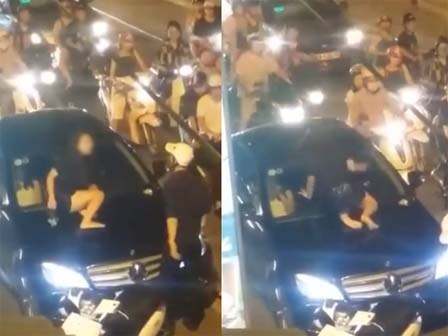 Ghen tuông, cô gái trẻ gào khóc trèo lên nắp capô đập kính xe Mercedes giữa phố?