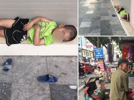 Em bé 4 tuổi nằm vạ vật trên vỉa hè chờ bố chạy xe ôm