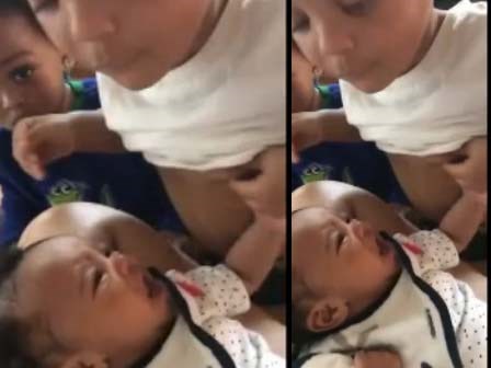Em mãi không chịu nín khóc, cậu bé liền vạch áo cho em ti