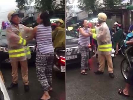 Người phụ nữ nắm cổ áo, lớn tiếng với CSGT ở Sài Gòn