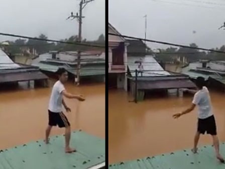 Người dân Quảng Nam đứng trên nóc nhà tiếp tế mì tôm cho nhau giữa ngày bão