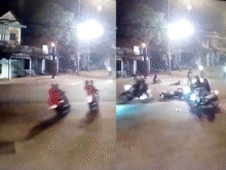 Hai xe máy đi song song vượt đèn đỏ gây tai nạn liên hoàn