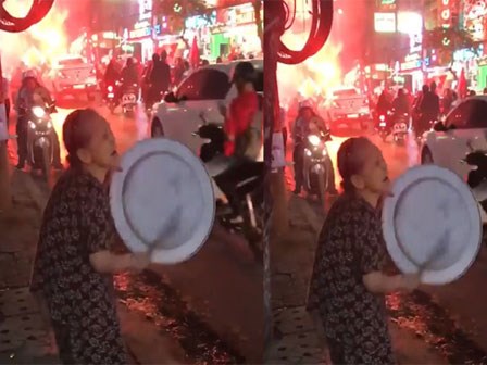 Cụ bà cầm mâm ra đường gõ sau chiến thắng U23 Việt Nam