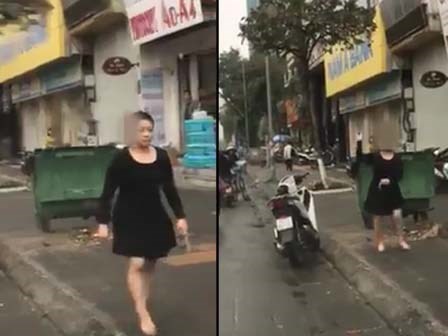 Clip xôn xao: Người phụ nữ chửi bới, cầm gạch tương thẳng kính chắn gió ô tô vì tiếng còi xe
