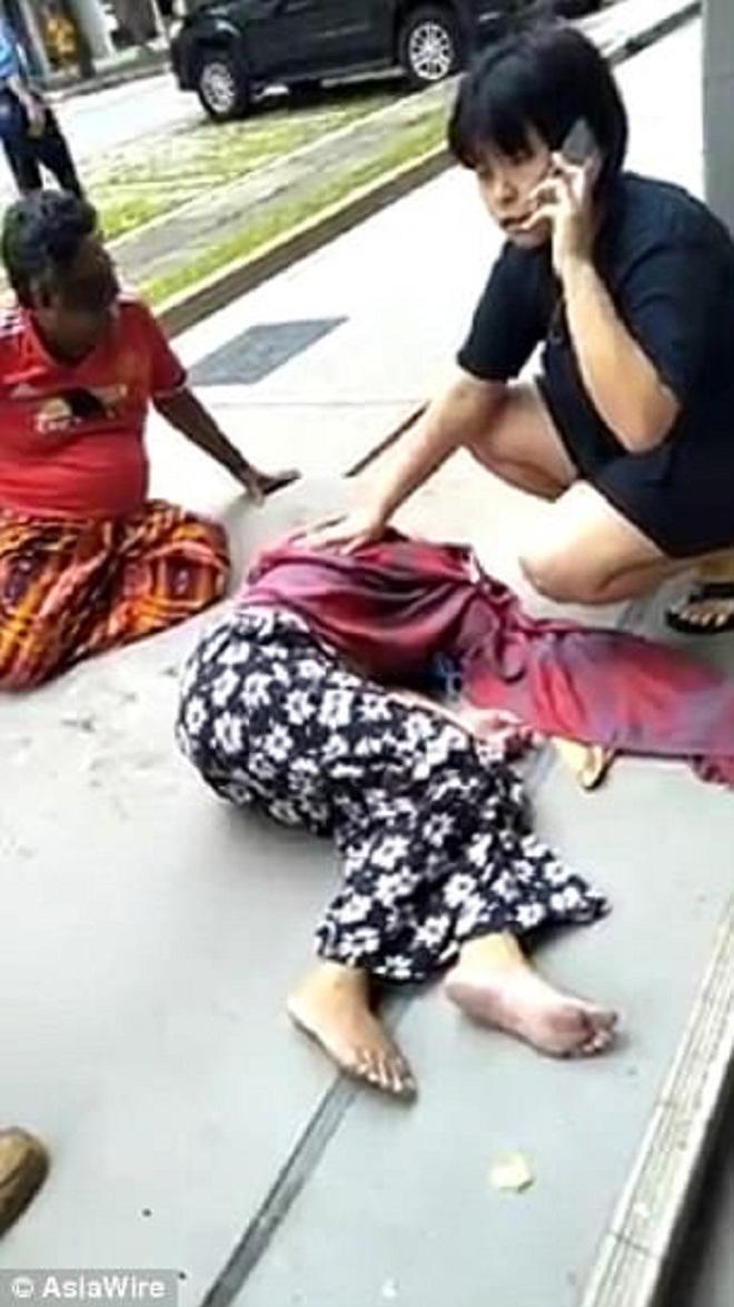 Ăn ở tầng 2, nhoài người túm tóc người phụ nữ rơi từ tầng 3-2