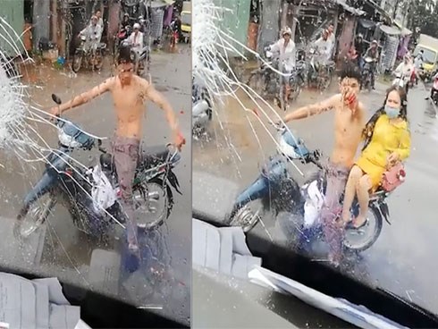 Thanh niên chở bạn gái ném gạch, đấm vỡ kính xe khách khi bị tạt nước cống