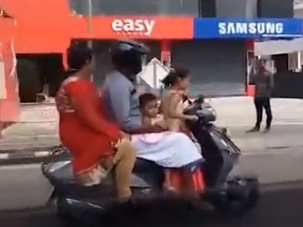 Clip bé gái 5 tuổi phóng xe tay ga lao vun vút trên đường, chở bố mẹ và em gái 3 tuổi ngồi sau gây sốc