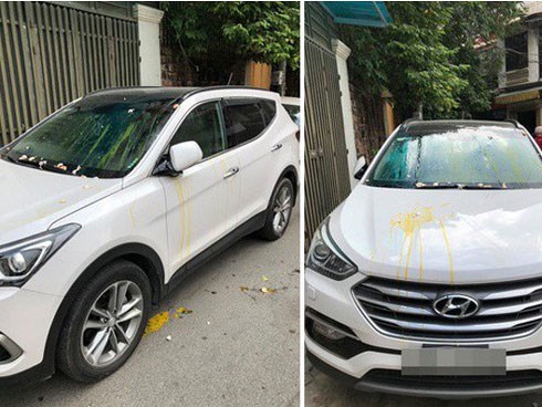 Đỗ thiếu ý thức, xe ô tô trắng bị ném trứng sống trên phố Hà Nội?