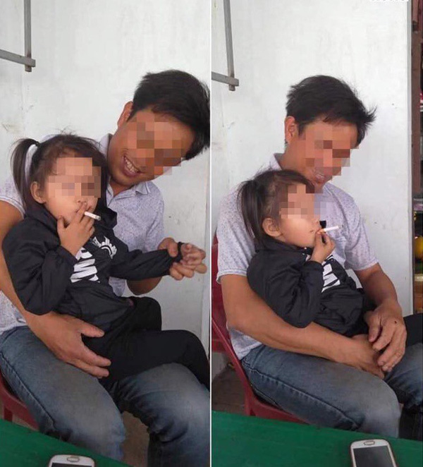 Bé gái vui vẻ hút thuốc lá, thái độ kì lạ của ông bố ngồi bên cạnh gây bức xúc-1
