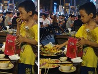 Rớt nước mắt hình ảnh cậu bé nhặt nhạnh chút đồ thừa trên bàn rồi ăn ngấu nghiến để lấp đầy chiếc bụng đói giữa phố Sài Gòn