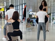 Cặp đôi hồn nhiên tập squat, bồng bế nhau như nâng tạ ở giữa sân bay khiến nhiều người ngỡ ngàng