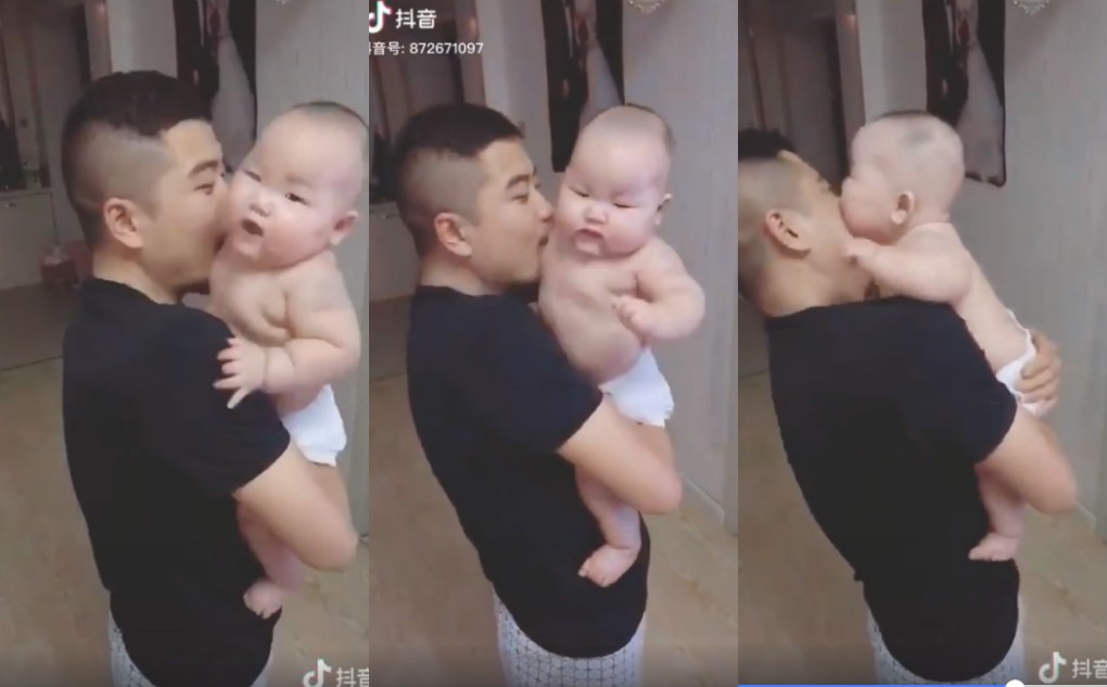 Thân hình mũm mĩm quá đáng yêu khiến bố phải cắn cho 1 miếng, nhưng phản ứng của cậu bé mới thật bất ngờ-1