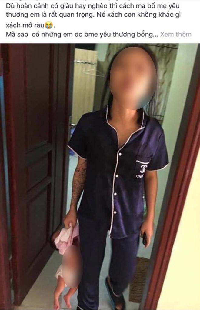 Người mẹ trẻ túm áo, xách con nhỏ lơ lửng trên tay, dân mạng lại phản ứng bất ngờ-1