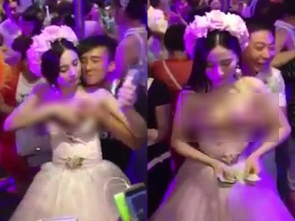 Cô dâu ngực khủng vô tư để quan khách sờ soạng, bóp nắn vì mục đích không thể chấp nhận?-1