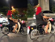 Thót tim nữ 'ninja' đi băng băng trên đường Hà Nội, 1 tay lái xe máy, 1 tay... bồng con nhỏ