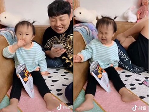 Đút đồ ăn cho bố lại bị nuốt cả tay, cô bé có phản ứng bất ngờ khiến dân mạng cười lăn cười bò