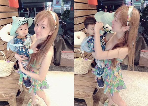 Mặc váy cúp ngực bế con, mẹ trẻ vô tình để lộ ngực khủng đốt mắt dân tình-1